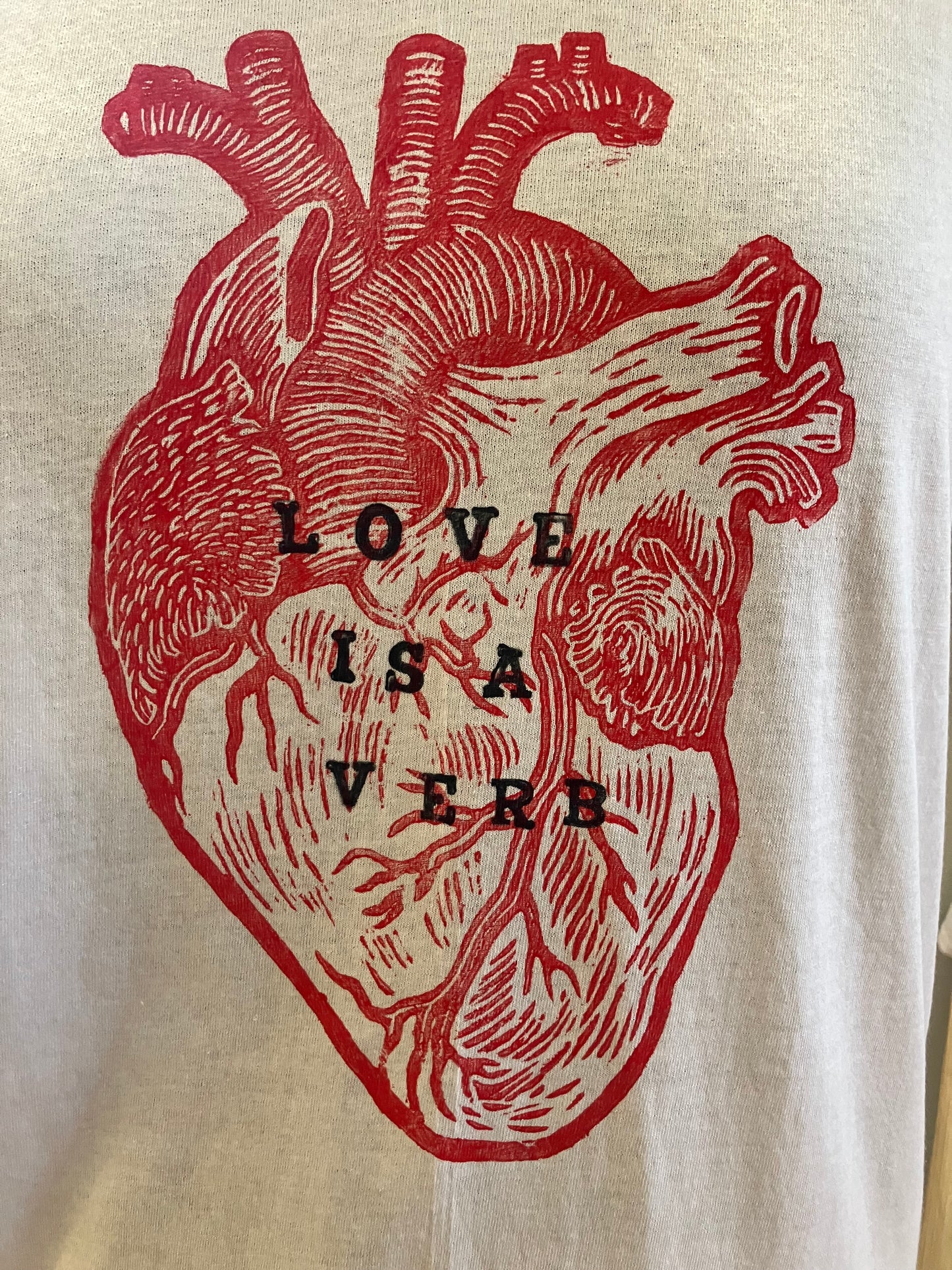 Love is a Verb white T